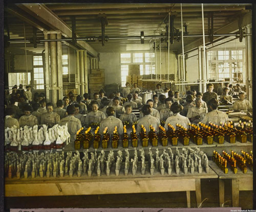 workers_at_the_maggi_factory_in_singen_germany_packaging_bottles_of_liquid_seasoning_approx.1910___1_.jpg
